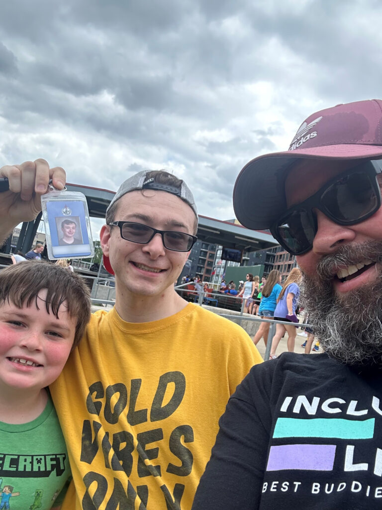 Best Buddies DNI family of 3 attending a large public event in Nashville